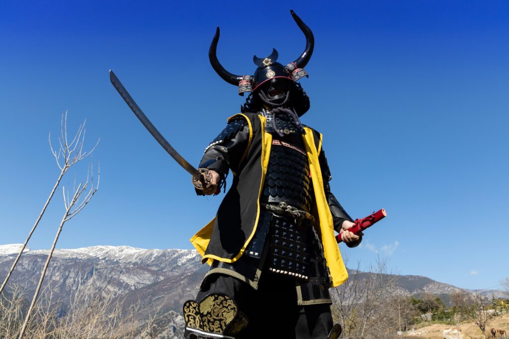 japanese samurai warrior dressed in armor with a mesmerizing mountainous background